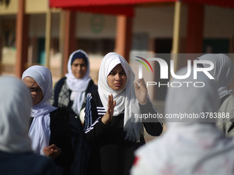 Deaf Palestinian students the school yard at first school in Palestine care with them, on 10 February 2019. (