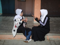 Deaf Palestinian students the school yard at first school in Palestine care with them, on 10 February 2019. (