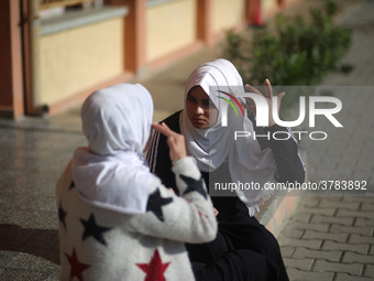 Deaf Palestinian students the school yard at first school in Palestine care with them, on 10 February 2019. (