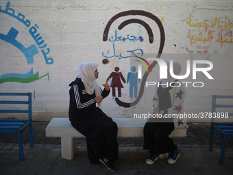 Deaf Palestinian students the school yard at first school in Palestine care with them, on 10 February 2019. (