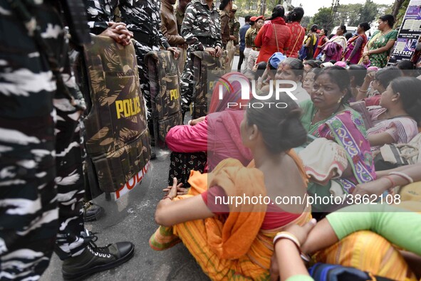 The cooks and helpers of Mid Day Meals of All Assam Secondary Schools held a protest demonstration against handing over the running of mid d...