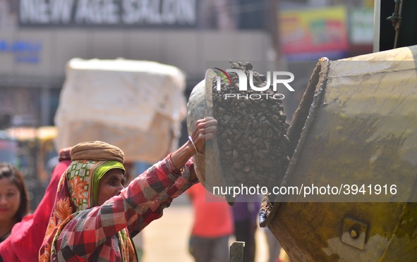 An Indian women works at a constructions site on the eve of International Women’s Day in Dimapur, India North eastern state of Nagaland on T...