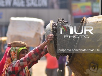 An Indian women works at a constructions site on the eve of International Women’s Day in Dimapur, India North eastern state of Nagaland on T...