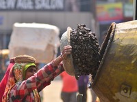 An Indian women works at a constructions site on the eve of International Women’s Day in Dimapur, India North eastern state of Nagaland on T...