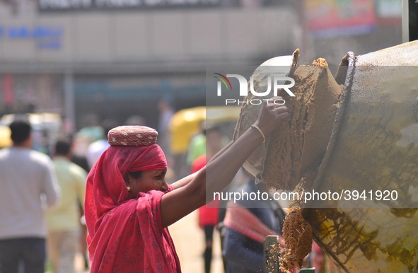 An Indian women works at a constructions site on the eve of International Women’s Day in Dimapur, India North eastern state of Nagaland on T...