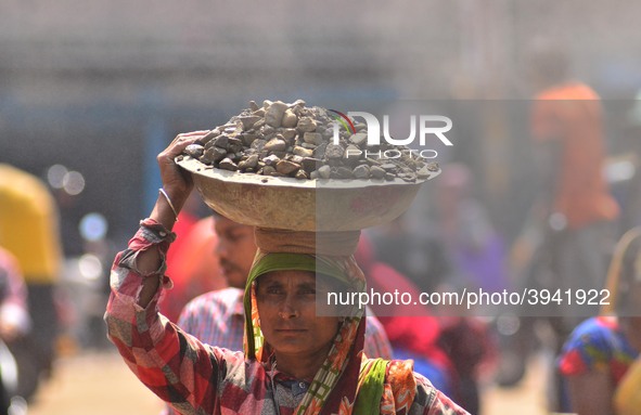 An Indian women works at a constructions site on the eve of International Women’s Day in Dimapur, India North eastern state of Nagaland on T...