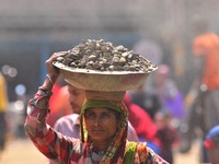 An Indian women works at a constructions site on the eve of International Women’s Day in Dimapur, India North eastern state of Nagaland on T...