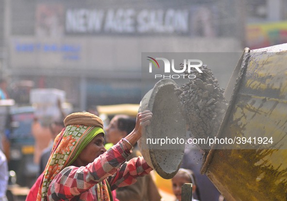 An Indian women works at a constructions site on the eve of International Women’s Day in Dimapur, India North eastern state of Nagaland on T...