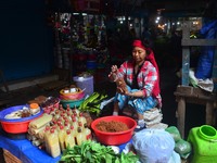 A Woman sells vegetables on the street on the eve of International Women’s Day in Dimapur,  India North eastern state of Nagaland on Thursda...