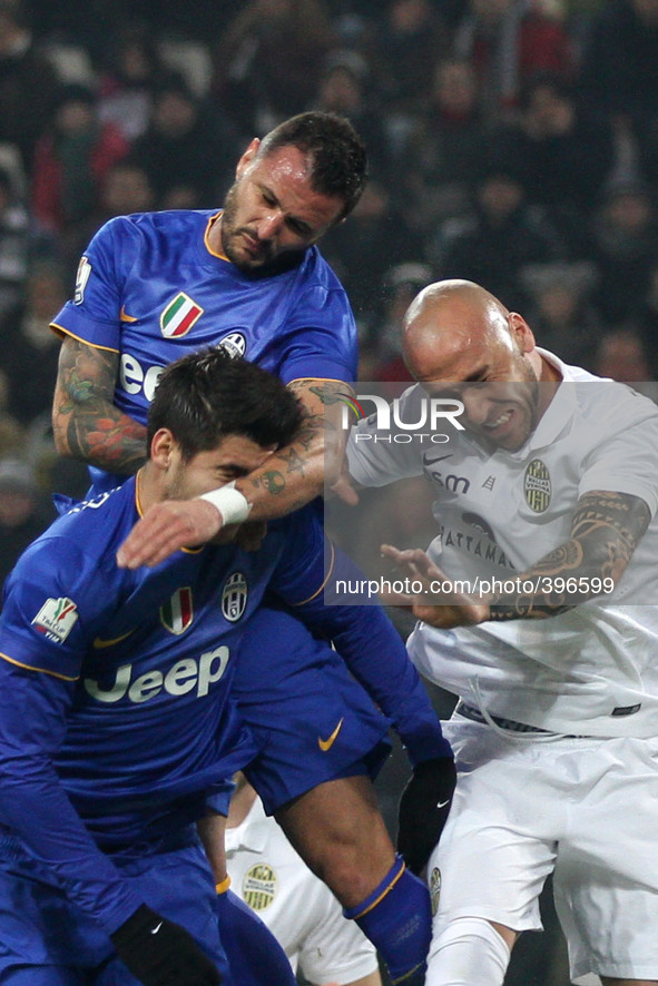 Juventus forward Alvaro Morata (9) and Juventus midfielder Simone Pepe (7) head the ball during the Coppa Italia round of 16 football match...