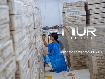 A woman working in the shipping department of a garment factory in Bangalore. Many of the workers emigrate from poor regions of the country,...