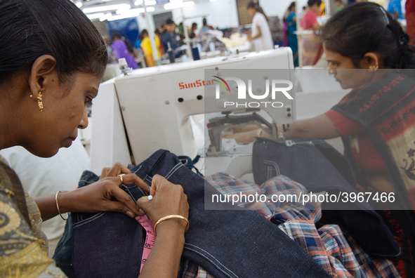 Seamstresses making clothing at a garment factory in Bangalore. Many of the workers emigrate from poor regions of the country, making clothe...