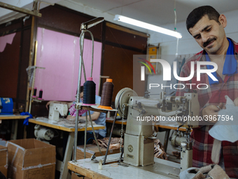 Workers making shoes in a small basement factory in the Zeytinburnu neighborhood of Istanbul, where a mix of immigrant and Turkish workers a...