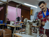 Workers making shoes in a small basement factory in the Zeytinburnu neighborhood of Istanbul, where a mix of immigrant and Turkish workers a...