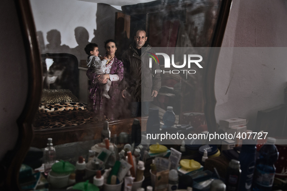 Family portrait: El Hajbi Meriam (doughter, Absaoui Elbouchtaouia (mother), El Hajbi Bouazza (father), in Novara, Italy.  Exporti is a reali...