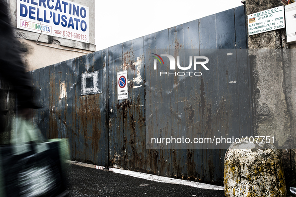 A person going back from second hand market, in Novara, Italy.  Exporti is a reality tale made up out of mistakes and powerlessness. Exporti...