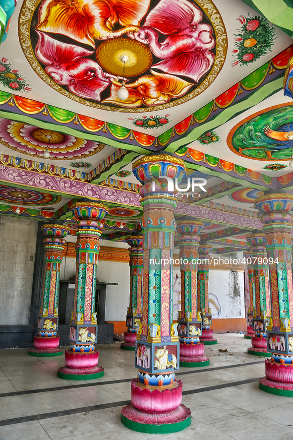 Colorful patterns and religious symbols adorn the columns at the Madduvil Panriththalaichchi Amman Kovil (Madduvil Panriththalachchi Amman H...