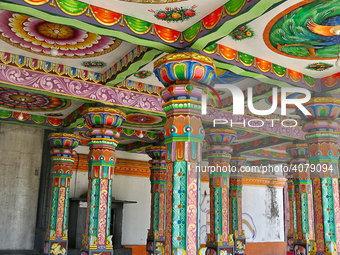 Colorful patterns and religious symbols adorn the columns at the Madduvil Panriththalaichchi Amman Kovil (Madduvil Panriththalachchi Amman H...