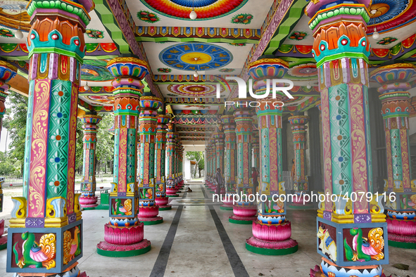 Colorful patterns and religious symbols adorn the columns at the Madduvil Panriththalaichchi Amman Kovil (Madduvil Panriththalachchi Amman H...