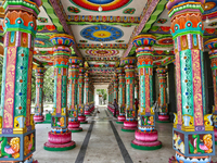 Colorful patterns and religious symbols adorn the columns at the Madduvil Panriththalaichchi Amman Kovil (Madduvil Panriththalachchi Amman H...