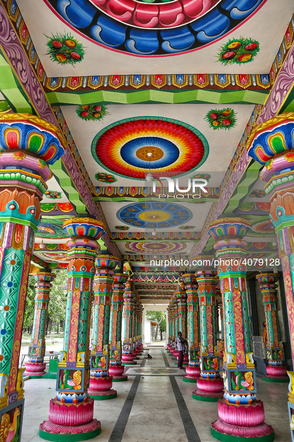 Colorful patterns and religious symbols adorn the columns at the Madduvil Panriththalaichchi Amman Kovil (Madduvil Panriththalachchi Amman H...