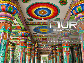 Colorful patterns and religious symbols adorn the columns at the Madduvil Panriththalaichchi Amman Kovil (Madduvil Panriththalachchi Amman H...