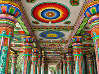 Colorful patterns and religious symbols adorn the columns at the Madduvil Panriththalaichchi Amman Kovil (Madduvil Panriththalachchi Amman H...