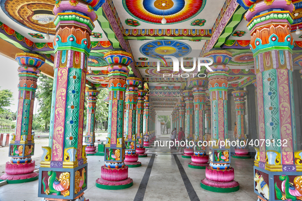 Colorful patterns and religious symbols adorn the columns at the Madduvil Panriththalaichchi Amman Kovil (Madduvil Panriththalachchi Amman H...