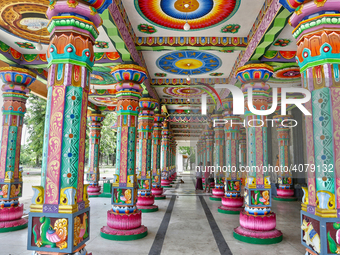 Colorful patterns and religious symbols adorn the columns at the Madduvil Panriththalaichchi Amman Kovil (Madduvil Panriththalachchi Amman H...