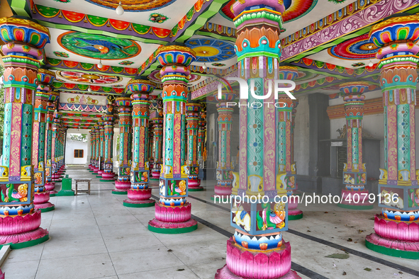 Colorful patterns and religious symbols adorn the columns at the Madduvil Panriththalaichchi Amman Kovil (Madduvil Panriththalachchi Amman H...