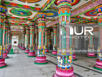 Colorful patterns and religious symbols adorn the columns at the Madduvil Panriththalaichchi Amman Kovil (Madduvil Panriththalachchi Amman H...