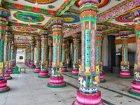 Colorful patterns and religious symbols adorn the columns at the Madduvil Panriththalaichchi Amman Kovil (Madduvil Panriththalachchi Amman H...