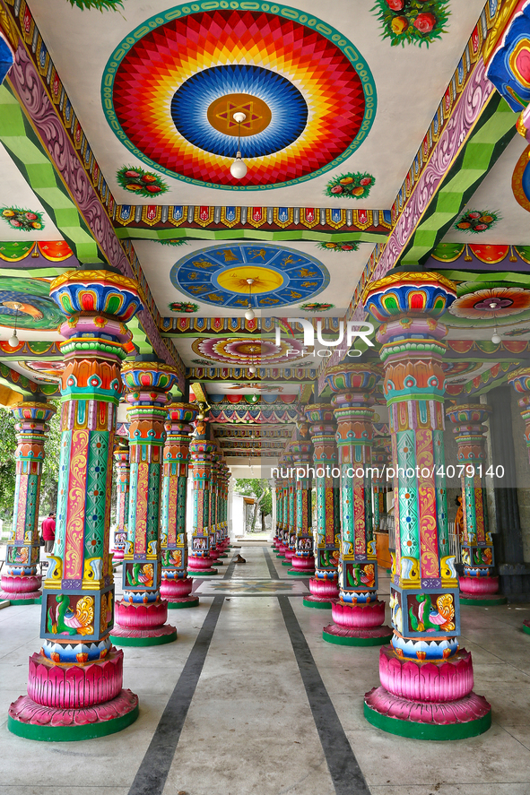 Colorful patterns and religious symbols adorn the columns at the Madduvil Panriththalaichchi Amman Kovil (Madduvil Panriththalachchi Amman H...