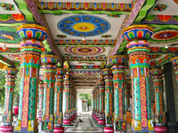 Colorful patterns and religious symbols adorn the columns at the Madduvil Panriththalaichchi Amman Kovil (Madduvil Panriththalachchi Amman H...