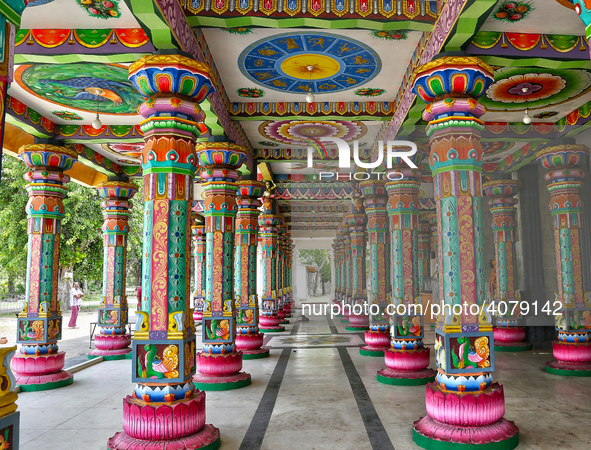 Colorful patterns and religious symbols adorn the columns at the Madduvil Panriththalaichchi Amman Kovil (Madduvil Panriththalachchi Amman H...