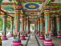 Colorful patterns and religious symbols adorn the columns at the Madduvil Panriththalaichchi Amman Kovil (Madduvil Panriththalachchi Amman H...