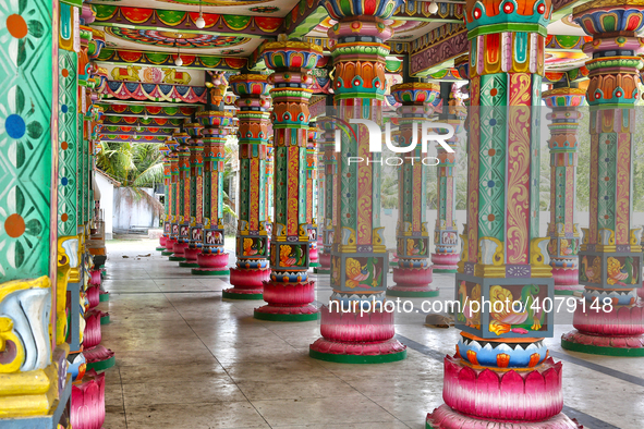 Colorful patterns and religious symbols adorn the columns at the Madduvil Panriththalaichchi Amman Kovil (Madduvil Panriththalachchi Amman H...