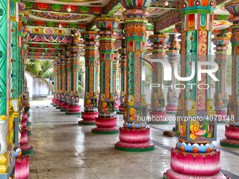 Colorful patterns and religious symbols adorn the columns at the Madduvil Panriththalaichchi Amman Kovil (Madduvil Panriththalachchi Amman H...