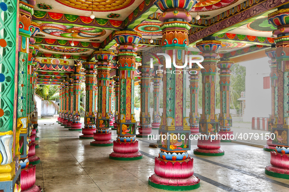 Colorful patterns and religious symbols adorn the columns at the Madduvil Panriththalaichchi Amman Kovil (Madduvil Panriththalachchi Amman H...