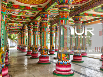 Colorful patterns and religious symbols adorn the columns at the Madduvil Panriththalaichchi Amman Kovil (Madduvil Panriththalachchi Amman H...