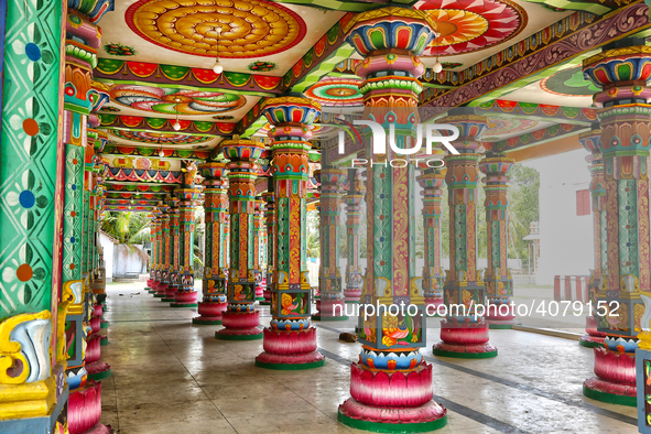 Colorful patterns and religious symbols adorn the columns at the Madduvil Panriththalaichchi Amman Kovil (Madduvil Panriththalachchi Amman H...