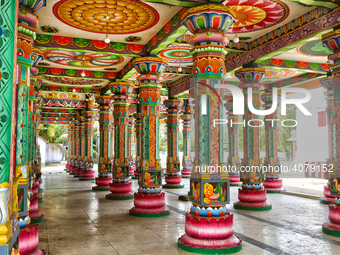 Colorful patterns and religious symbols adorn the columns at the Madduvil Panriththalaichchi Amman Kovil (Madduvil Panriththalachchi Amman H...