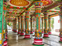 Colorful patterns and religious symbols adorn the columns at the Madduvil Panriththalaichchi Amman Kovil (Madduvil Panriththalachchi Amman H...