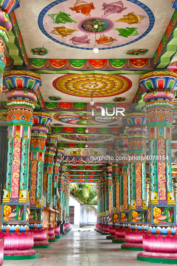 Colorful patterns and religious symbols adorn the columns at the Madduvil Panriththalaichchi Amman Kovil (Madduvil Panriththalachchi Amman H...