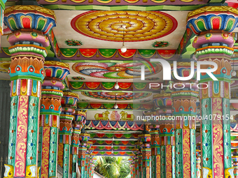 Colorful patterns and religious symbols adorn the columns at the Madduvil Panriththalaichchi Amman Kovil (Madduvil Panriththalachchi Amman H...