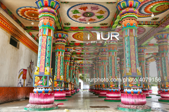 Colorful patterns and religious symbols adorn the columns at the Madduvil Panriththalaichchi Amman Kovil (Madduvil Panriththalachchi Amman H...