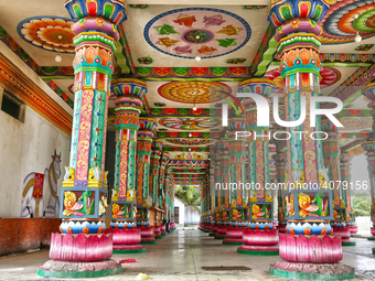 Colorful patterns and religious symbols adorn the columns at the Madduvil Panriththalaichchi Amman Kovil (Madduvil Panriththalachchi Amman H...