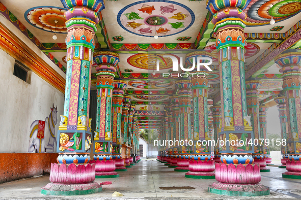 Colorful patterns and religious symbols adorn the columns at the Madduvil Panriththalaichchi Amman Kovil (Madduvil Panriththalachchi Amman H...