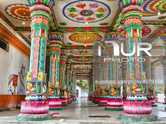 Colorful patterns and religious symbols adorn the columns at the Madduvil Panriththalaichchi Amman Kovil (Madduvil Panriththalachchi Amman H...