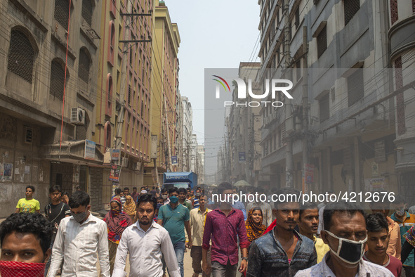 Workers coming out from different garments factories on their way home during lunch break in Narayanganj on April 24, 2019. 